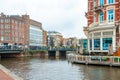 Amsterdam, Netherlands - 15.10.2019: Typical Amsterdam scene with colored buildings, canals, bridges and bicycles Royalty Free Stock Photo