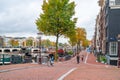 Amsterdam, Netherlands - 15.10.2019: Typical Amsterdam scene with colored buildings, canals, bridges and bicycles Royalty Free Stock Photo