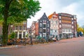 Amsterdam, Netherlands - 15.10.2019: Typical Amsterdam scene with colored buildings, canals, bridges and bicycles Royalty Free Stock Photo