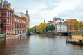 Amsterdam, Netherlands - 15.10.2019: Typical Amsterdam scene with colored buildings, canals, bridges and bicycles Royalty Free Stock Photo