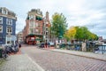 Amsterdam, Netherlands - 14.10.2019: Typical Amsterdam scene with colored buildings, canals, bridges and bicycles Royalty Free Stock Photo