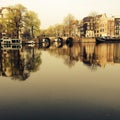 Amsterdam/THE NETHERLANDS: A typical view of the Amstel canal with old mansions in the center of Amsterdam, the N