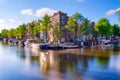 Amsterdam, Netherlands. View of houses and bridges. The famous Dutch canals and bridges. A cityscape at the day time.