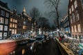 Amsterdam night city water canal with evening lights reflection and old houses, Amsterdam, Netherlands Royalty Free Stock Photo