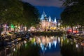 Amsterdam, with flowers and bicycles on the bridges over the canals, Holland, Netherlands. Royalty Free Stock Photo