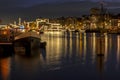 Amsterdam by night with the illuminated Tiny Bridge at the Amstel in the Netherlands at christmas Royalty Free Stock Photo