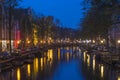 Amsterdam. Night view of Amsterdam cityscape with canal, bridge and typical Dutch Houses. Netherlands Royalty Free Stock Photo