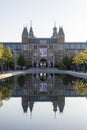 Exterior of the Rijksmuseum reflected in the water, early morning in Amsterdam, Noord-Holland, The Netherlands