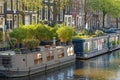 Typical Amsterdam living boats along the canal, dutch lifestyle Holland Netherlands Europe