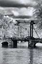 Amsterdam with old bridge over canal in Holland Royalty Free Stock Photo