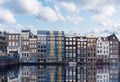 Amsterdam old buildings with canal in summer. Famous landmark and travel destination in Netherlands