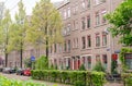 Amsterdam Oost. East side neighbourhoods. View of street, houses, street clock and sign