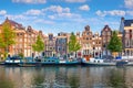 Amsterdam. Panoramic view of the historic city center of Amsterdam. Traditional houses and bridges of Amsterdam. An early quiet Royalty Free Stock Photo