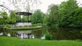 Amsterdam park with a lake, flowers grow around the gazebo