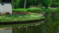 Amsterdam park with a lake, flowers grow around the gazebo