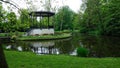 Amsterdam park with a lake, flowers grow around the gazebo