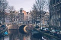 Amsterdam autumn in the morning, old city centre, bridge, canals of Amsterd Royalty Free Stock Photo