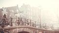 Amsterdam autumn in the morning, old city centre, bridge, canals of Amsterd Royalty Free Stock Photo