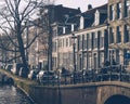 Amsterdam autumn in the morning, old city centre, bridge, canals of Amsterd Royalty Free Stock Photo