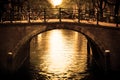 Amsterdam. Romantic bridge over canal. Royalty Free Stock Photo