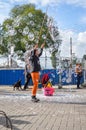 AMSTERDAM - SEPTEMBER 18, 2015: Woman making huge bubble balloon