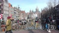 Amsterdam sightseeing tour. cold but sunny day, traditional bicycles on the Dutch canals. against the background classical Royalty Free Stock Photo