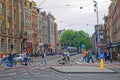 Amsterdam spring scene people crossing the road in city center Royalty Free Stock Photo