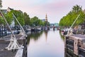 Amsterdam streets, canals during dusk on the Sint Antoniesluis Royalty Free Stock Photo