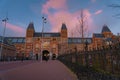 Amsterdam at summer night. Famous national Rijks museum general view at dusk