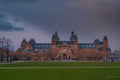 Amsterdam at summer night. Famous national Rijks museum general view at dusk