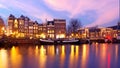 Amsterdam at sunsett at the river Amstel in the Netherlands Royalty Free Stock Photo