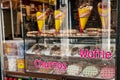 An Amsterdam sweet shop window, with waffles and churros available to buy.