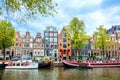 Amsterdam. View of the old houses, canal and boats. Famous place in the downtown of Amsterdam. Amsterdam, Holland, Netherlands,