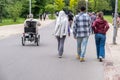 Amsterdam, Vondelpark at Netherlands. People biking or enjoy the walk, man on wheelchair, nature