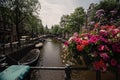 Amterdam cityscape with canal, bridge and typical Dutch Houses. Royalty Free Stock Photo