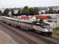 Amtrak train passes through Oakland Coliseum stop