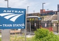 Amtrak train station sign and stairs to trains Royalty Free Stock Photo