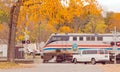 Amtrak train traveling through at railroad crossing