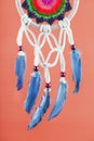 Amulet Dreamcatcher on a red background close-up protecting the sleeper Royalty Free Stock Photo