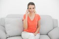 Amused ponytailed woman phoning looking at camera Royalty Free Stock Photo