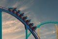 Amusement Kraken roller coaster on sunset background at Seaworld.