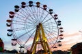 Amusement park on the background of the sunset. Royalty Free Stock Photo