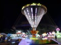 Amusement Park or Children`s Twister at night Odessa, Ukraine - July 2019