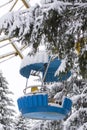 Amusement park. The first snow. Empty cabin from the Ferris wheel covered with snow. No people