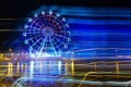 Amusement Park at night - Ferris wheel neon glow in motion