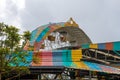 Amusement park old giant wheel colorful tin roof during heavy rain Royalty Free Stock Photo