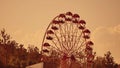 Amusement park sunset. Ferris Wheel Over Blue Sky. Amusement park