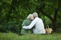 Amusing old couple in summer park