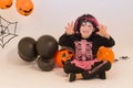 Pretty little girl dressing up as a witch in a Halloween setting Royalty Free Stock Photo