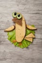 Amusing sandwich bird made on wooden background